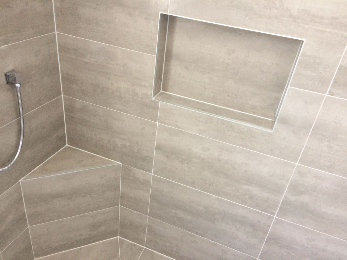 Tiled bathroom floor in an Auckland home