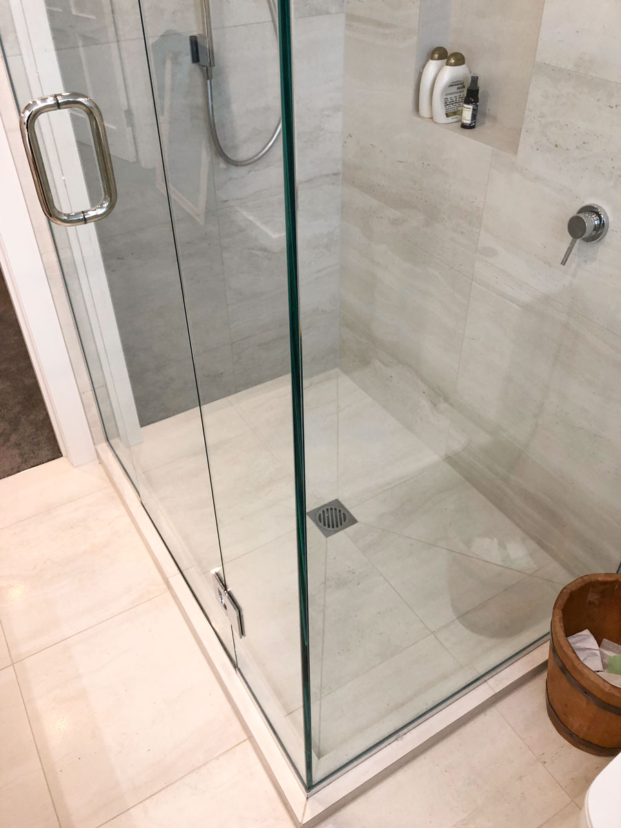 Fresh silicone at tiled shower junctions in Auckland