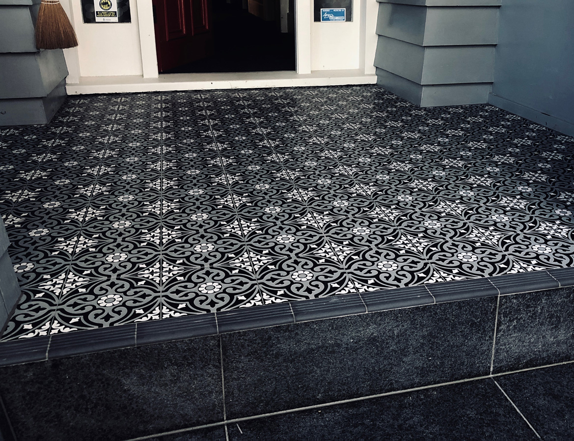Re-bedded floor tiles on an Auckland tiling job