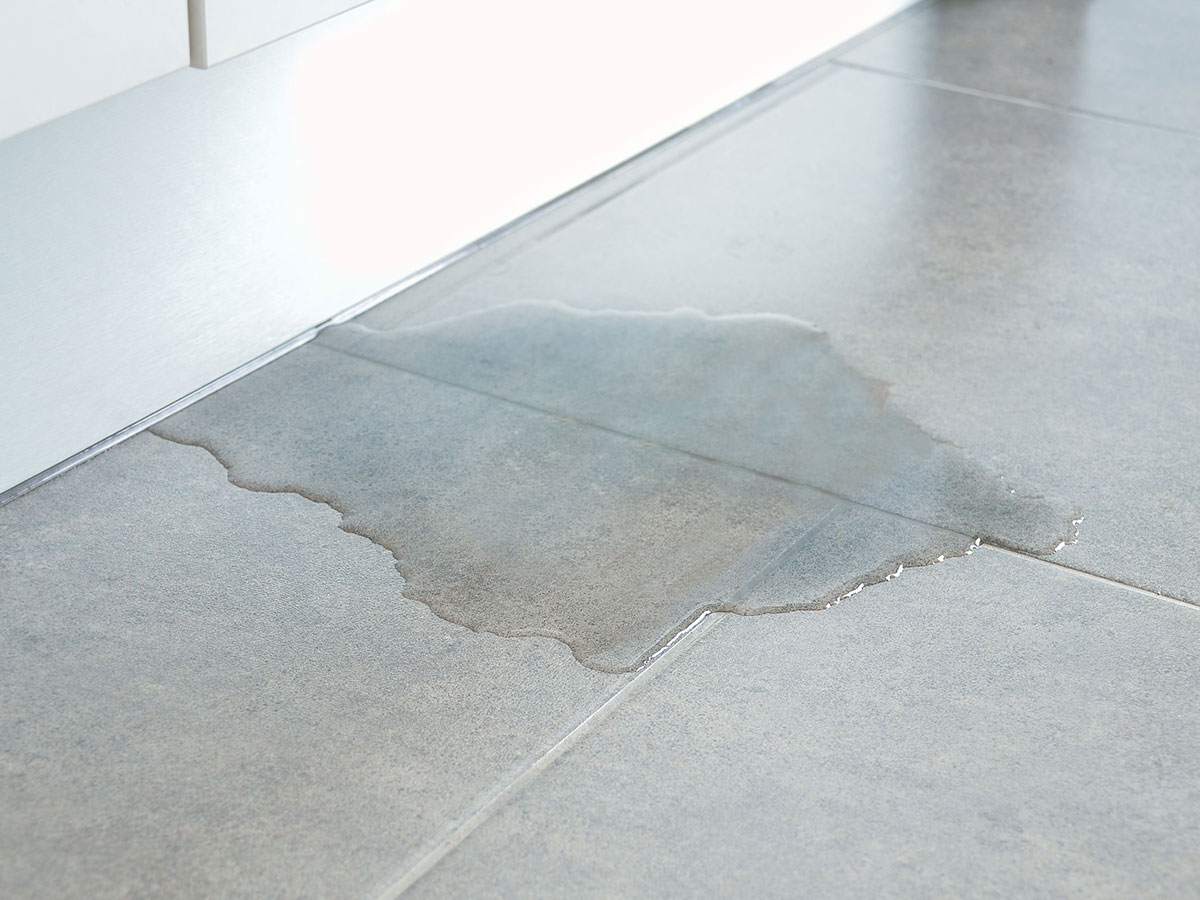 Slip-rated commercial floor tiles under wet conditions